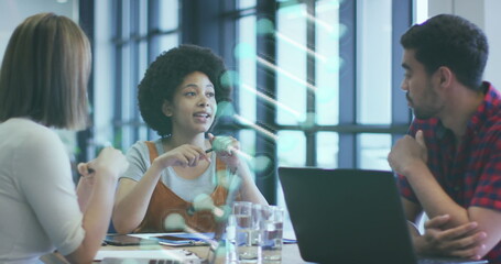 Image of dna strand spinning over diverse business people in office