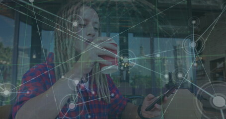 Image of network of connections with globe and data over caucasian man using smartphone