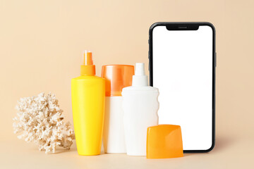 Bottles of sunscreen on color background