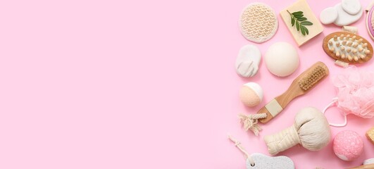 Set of spa supplies on pink background with space for text