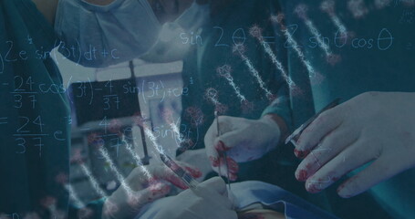 Image of dna rotating over hands of diverse surgeons during operation