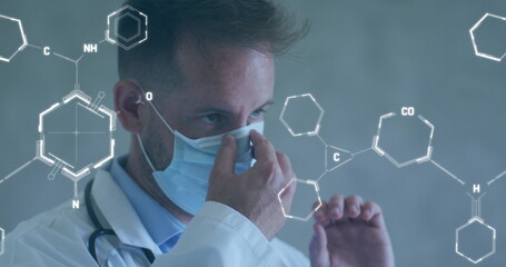 Image of chemical structures and data processing over caucasian male doctor with face mask