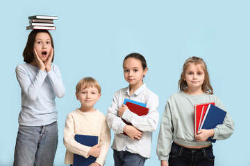 Little children with books on blue background