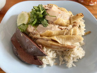 rice with chicken and vegetables on white plate