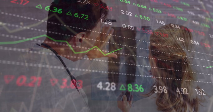 Image of financial data and graphs over caucasian female and male doctors