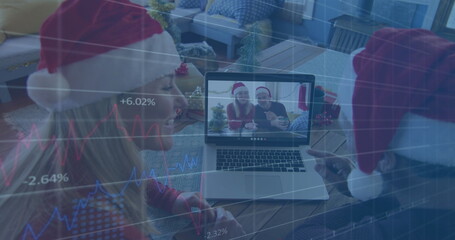 Image of database over caucasian couple wearing santa hats talking with friends over image call