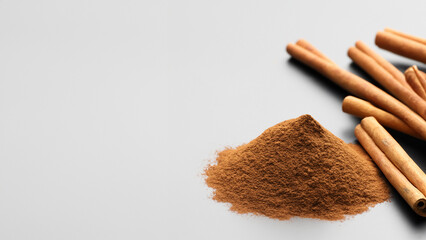 Cinnamon sticks and cinnamon powder on white background. Generative Ai - Powered by Adobe