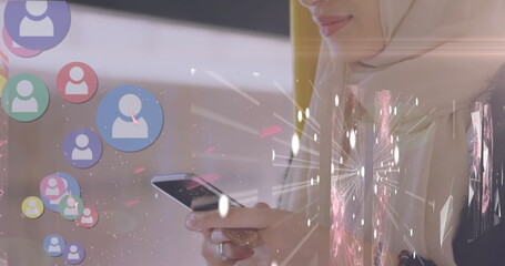 Image of globe over biracial female doctor using tablet