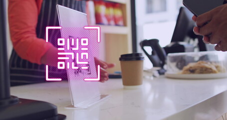 Image of qr code scanning over man paying with smartphone in shop