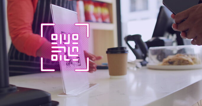 Image of qr code scanning over man paying with smartphone in shop