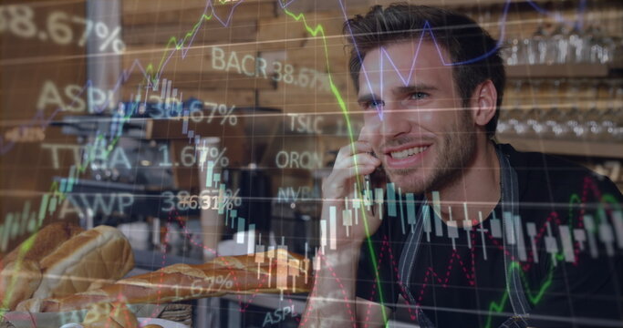 Image of stock market data processing over caucasian male waiter talking on smartphone at cafe