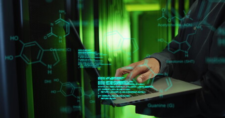 Image of medical data processing over mid section of male engineer using laptop at server room