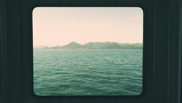 Dramatic view of beautiful sea looking out through the window, Travel or journey, Shipping, Naoshima Island in Kagawa Prefecture in Japan, 4K slow motion