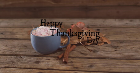 Image of happy thanksgiving day text over cocoa
