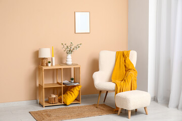Blooming branches on shelving unit in interior of stylish living room