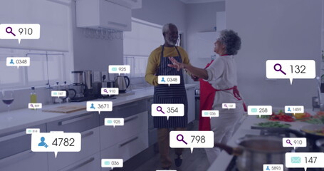 Image of notification bars over senior african american couple with apron dancing in kitchen