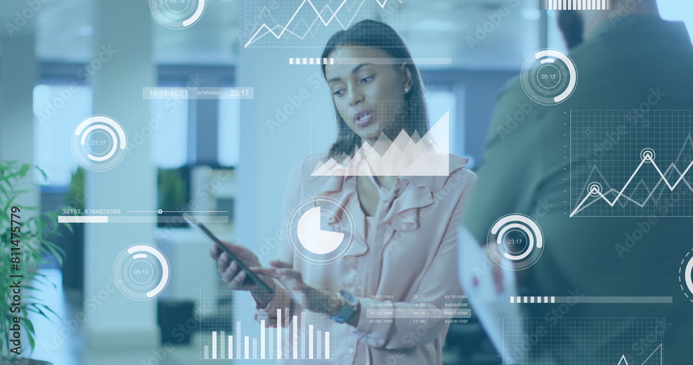 Wall mural Image of data processing over african american woman discussing with male colleague at office