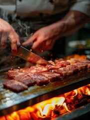 A chef preparing Wagyu beef in a restaurant. There is an open flame for grilling. 
