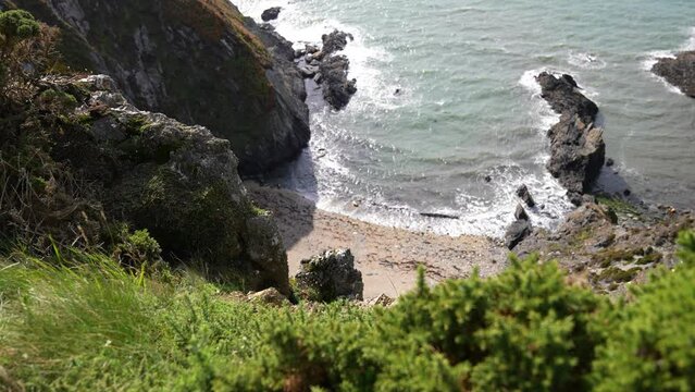 Scenic Coastline of Scotland, Lookout POV on Hidden Beach Under Steep Cliffs on Sunny Day
