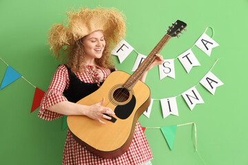 Happy young woman with guitar and FESTA JUNINA bunting on green background