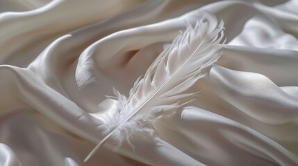 A serene image capturing the delicate beauty of a single, white feather elegantly placed on a smooth, soft fabric surface