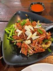 Raw meat beef cook, Spicy minced beef salad slice mixed with spices and herbs vegetable food of northeast Thailand style local.