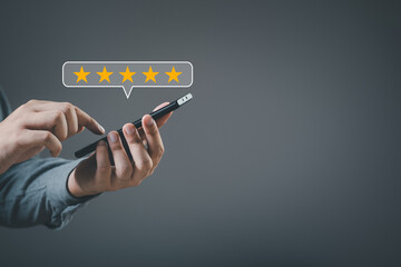Business people or customers show satisfaction through the application on the smart mobile phone...
