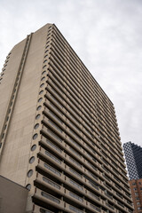 Exterior facade of a brutalist style apartment building in Calgary's downtown.