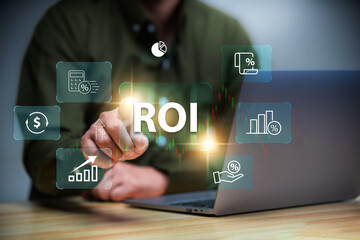 Return on investment (ROI) , Businessman using a sofware to analysis investment to get high  return.
