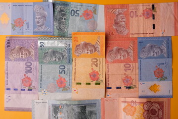Malaysian banknotes in denominations of 100 ringgit, 50, 20, 10 and 1. RM. Ringgit Malaysia banknotes.  
