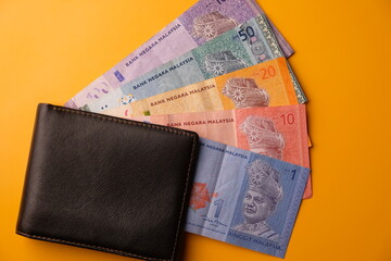 100, 50, 20, 10, 1 Malaysian ringgit notes in a wallet. economic concept. Ringgit Malaysia banknotes. Malaysian currency. 