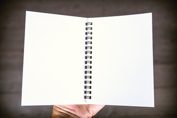 Notepad paper in hand man isolated