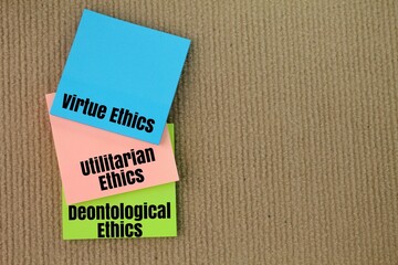 kertas berwarna dengan perkataan Virtue Ethics, Utilitarian Ethics dan Deontological Ethics. three...