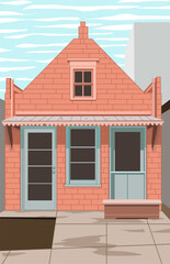 house with orange bricks and green door among tall buildings
