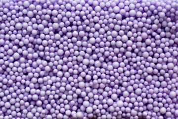 close up of purple foam beads for the background