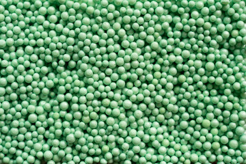 close up of green foam beads for the background