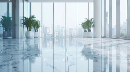 The photo shows a bright and spacious office lobby with a large marble floor, plants, and floor-to-ceiling windows.