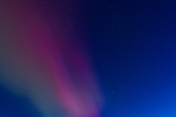 Obraz premium Northern lights at the zenith of the sky. Aurora Borealis or Northern Lights Latvia. Northern lights shining in the sky