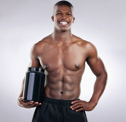 Black man, bodybuilder and jar in portrait for protein, powder or supplements in studio by white...