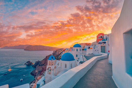 Europe summer destination. Traveling tourism, sunset scenic famous landscape of Santorini island, Oia, Greece. Caldera view, colorful clouds, dream cityscape. Vacation destination, honeymoon romance