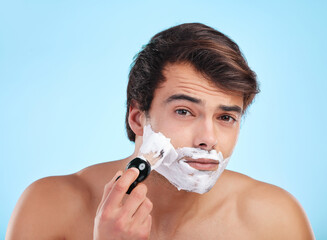 Portrait, man and shaving cream brush in studio for hair removal, hygiene and grooming isolated on...