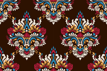 Seamless Indian ikat pattern on dark brown background vector illustration.Ikat floral embroidery traditional.design for texture,fabric,clothing,decoration