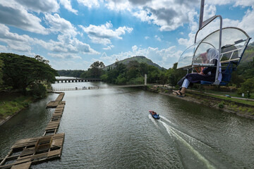 Fototapeta premium Ropeway in Kerala India. Malampuzha dam view at Palakkad district Kerala South India. Boating at Malampuzha garden hydroelectric dam. Photo taken form ropeway Ariel view of Indian dam. 