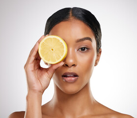 Lemon, skincare and portrait of woman in studio with natural organic and healthy facial treatment....