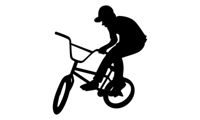 Obraz premium silhouette of boy showing off freestyle trick with bicycle
