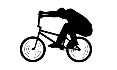 Obraz premium silhouette of boy showing off freestyle trick with bicycle