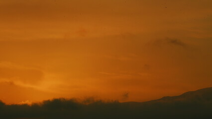 Beautiful Golden Sunrise. Silhouette Of The Mountain Hills Against Sunrise Sky. Still.