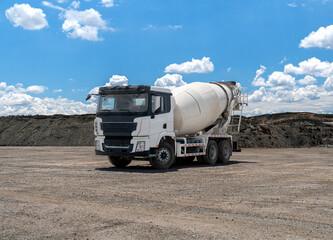 Concrete Truck or Cement mixer Industrial Machinery at Work as Cement Mixer Truck Heads to Construction Zone