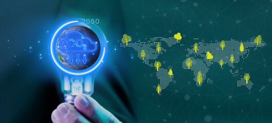 Net zero emissions by 2050 to change climate and net zero greenhouse gas emissions target. Sustainable development and green business concept. Businessman showing glowing neon line of net zero icon.