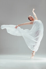 Ballet, performance and woman with fabric in studio for dancing, balance and art or sport. Female...